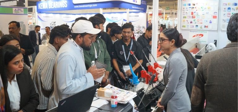 students discussing with exhibitors