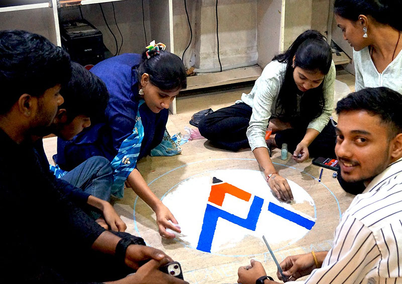 Team B making rangoli at rangoli design competition 2024